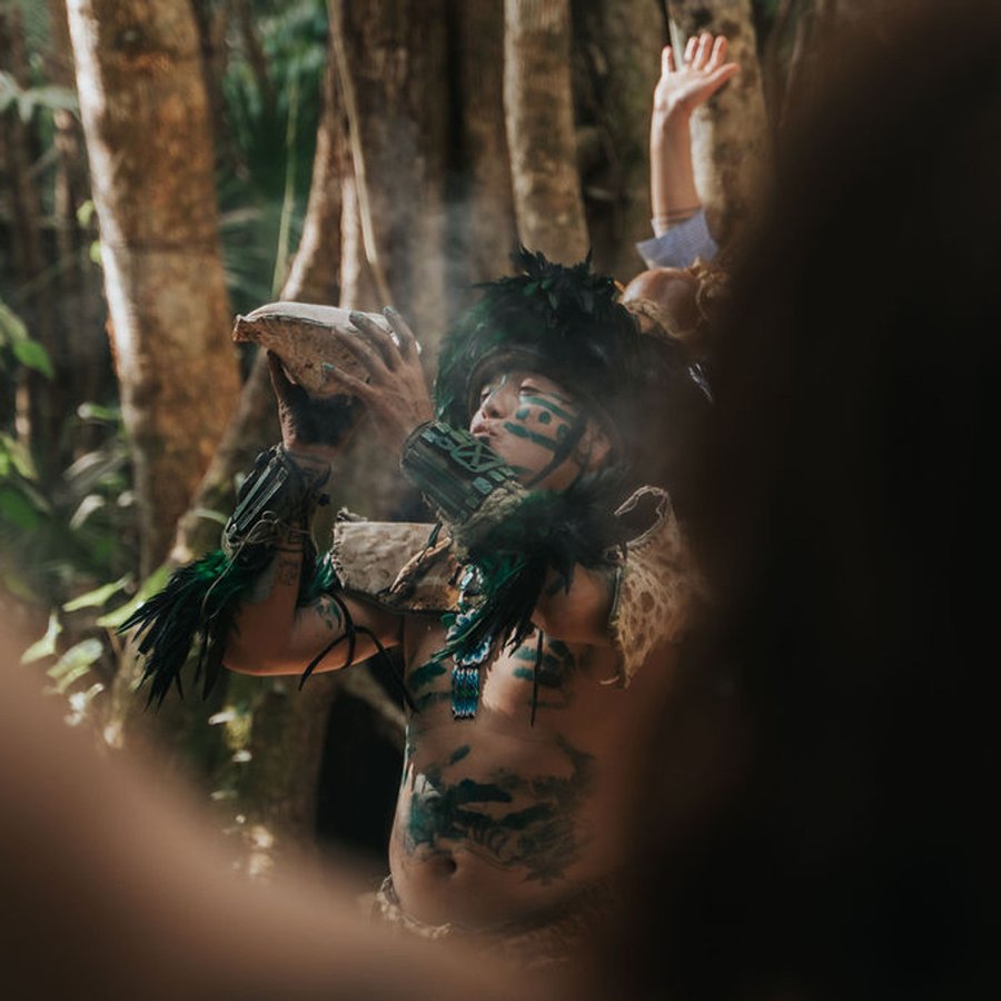 A Mayan shaman leading a jungle ceremony