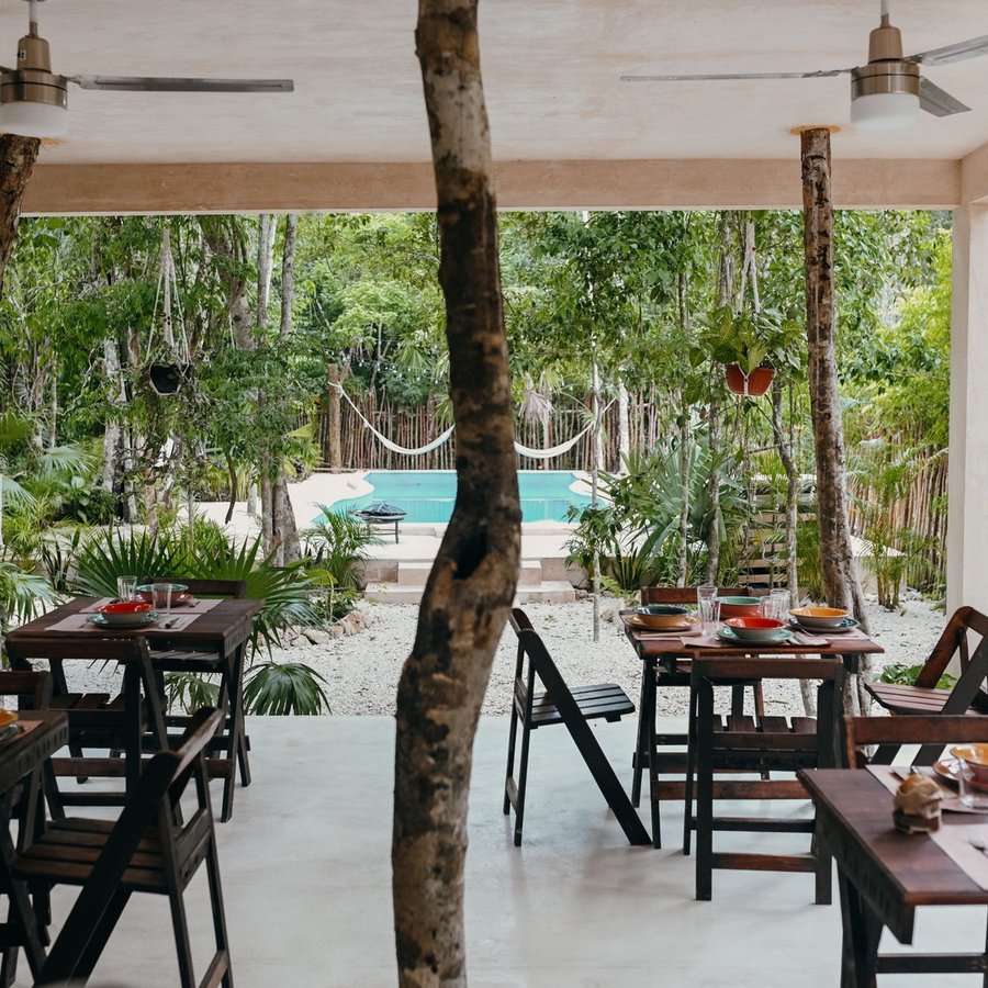Open-air dining beside the pool at Lunita