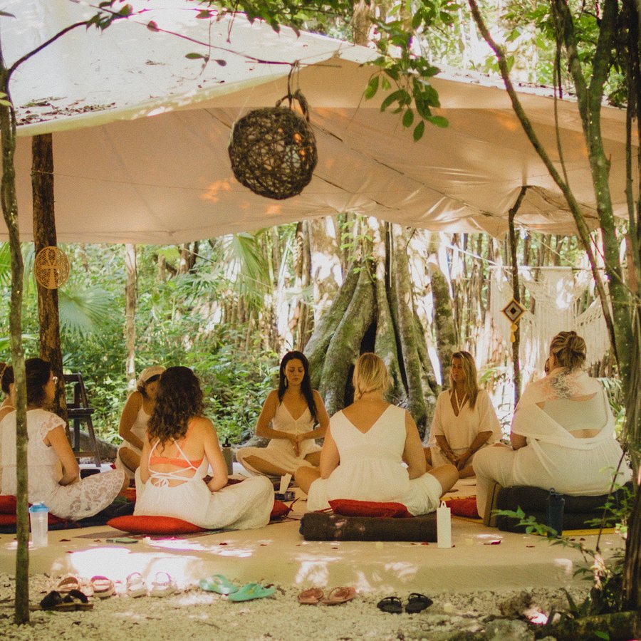 A women’s circle meditation in the jungle