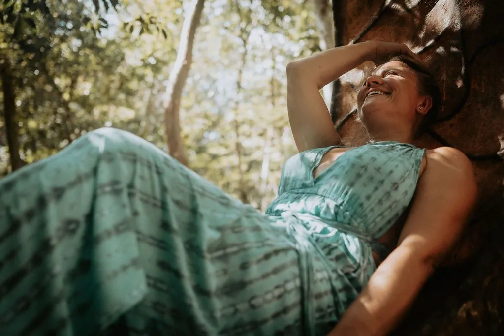 Maria Angelova laughing in the sunlit jungle at Lunita